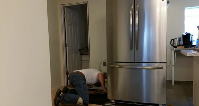 how to move a refrigerator to clean behind